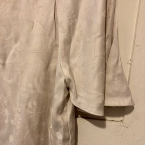 White flowy blouse with silky flower pattern
